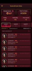 A busy city street at night with bright lights and moving traffic.